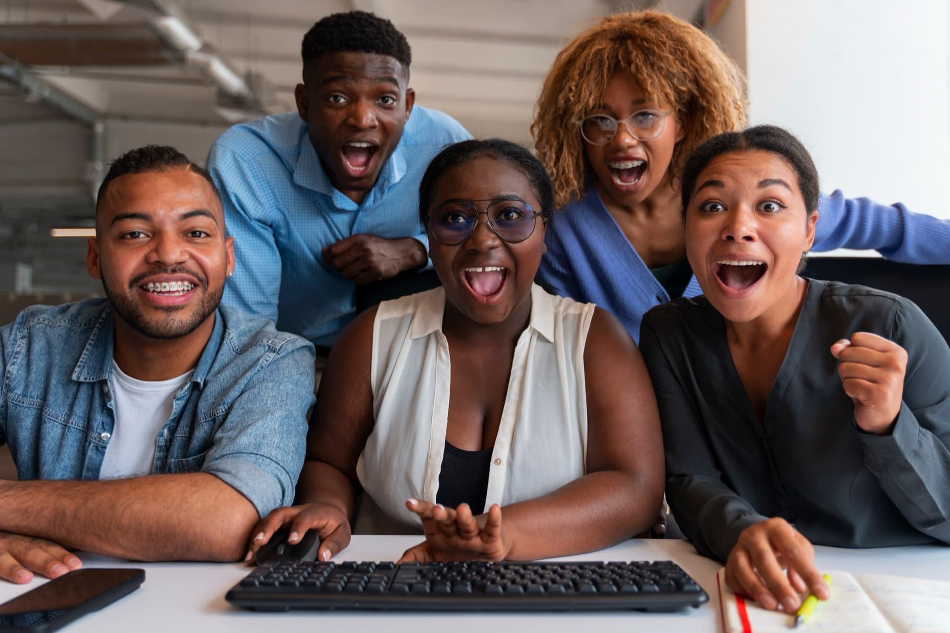 The Soft Solutions team collaborating at their desks