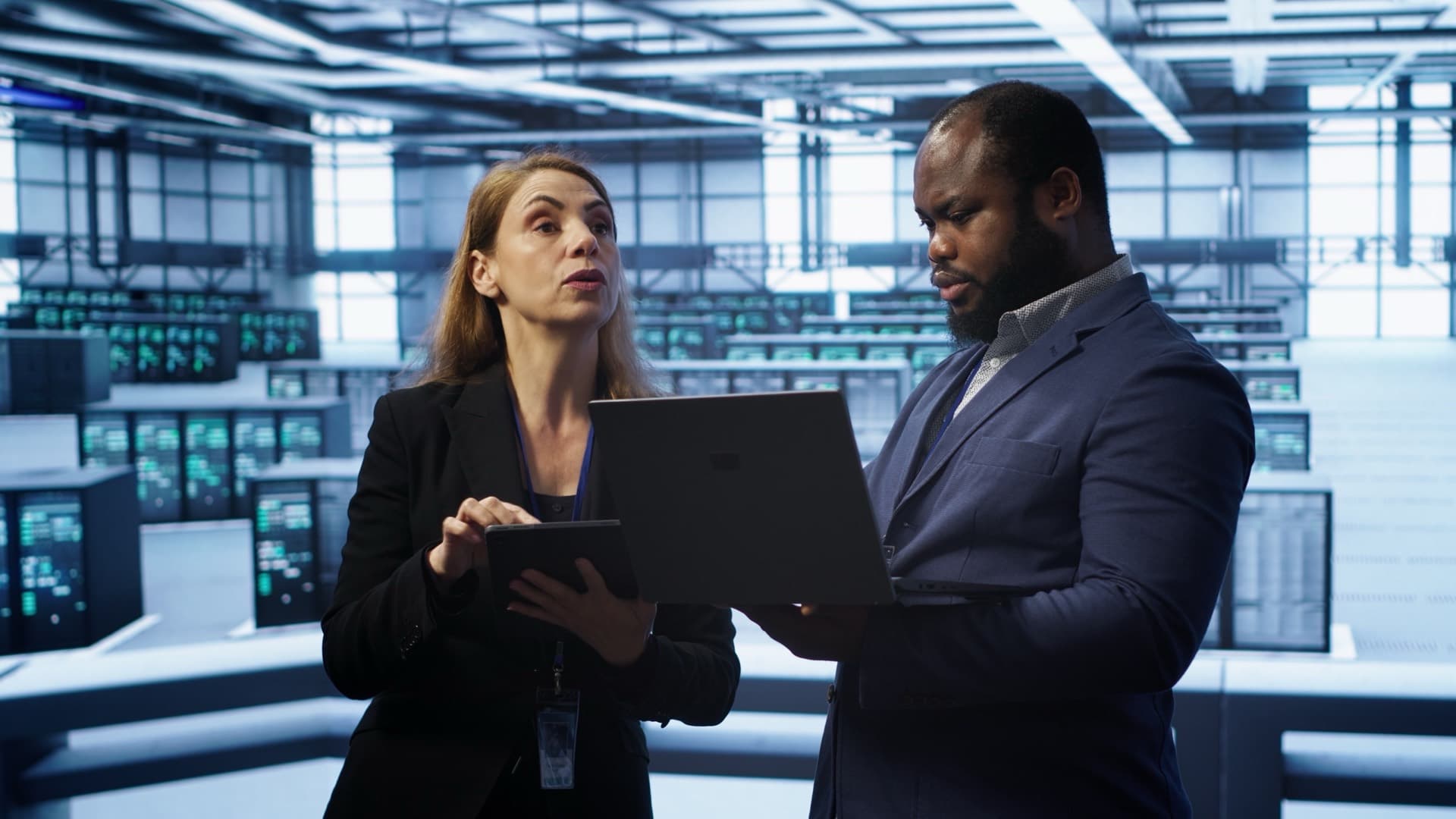 Supervisor and engineer auditing a server farm