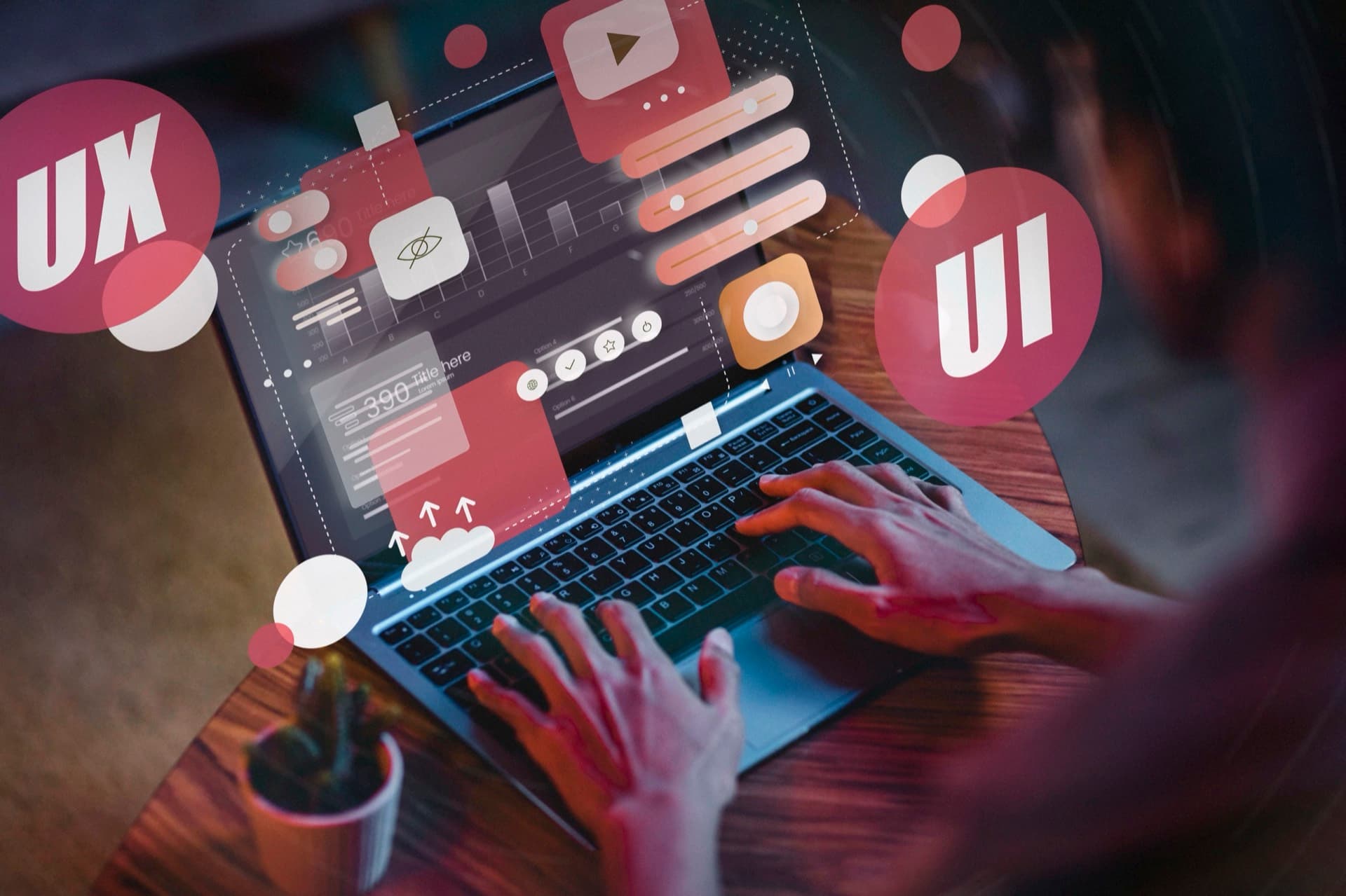 UI/UX design wireframes laid out beside a laptop